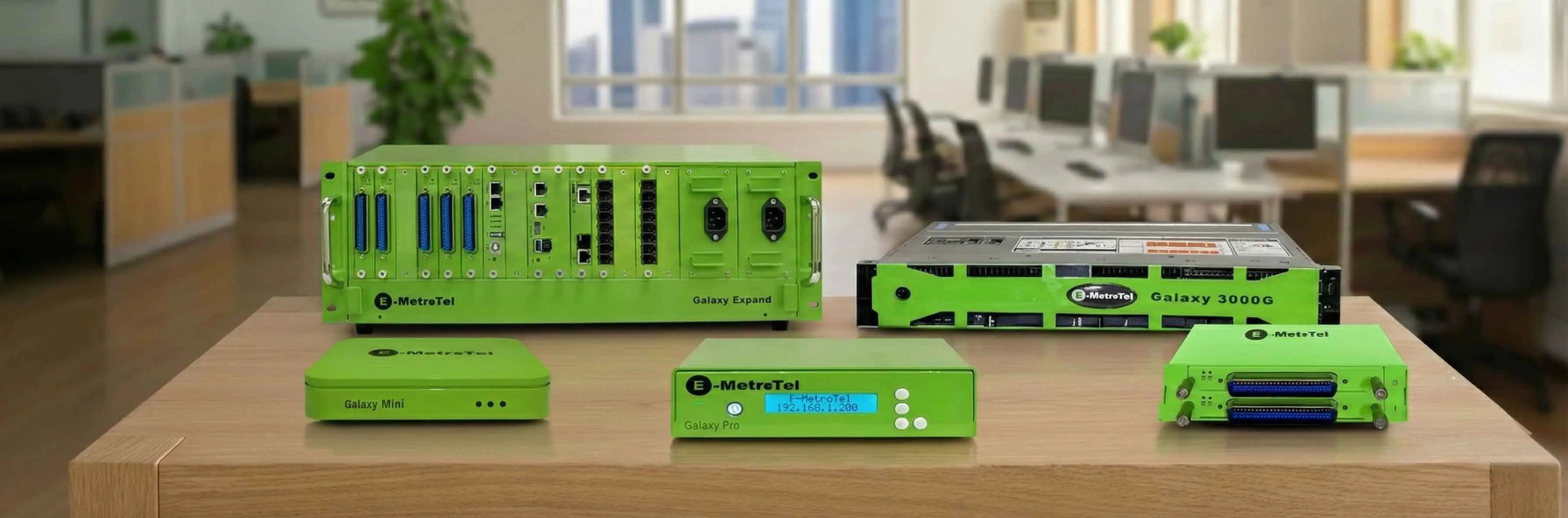 Green electronic testing devices on a table in an office.