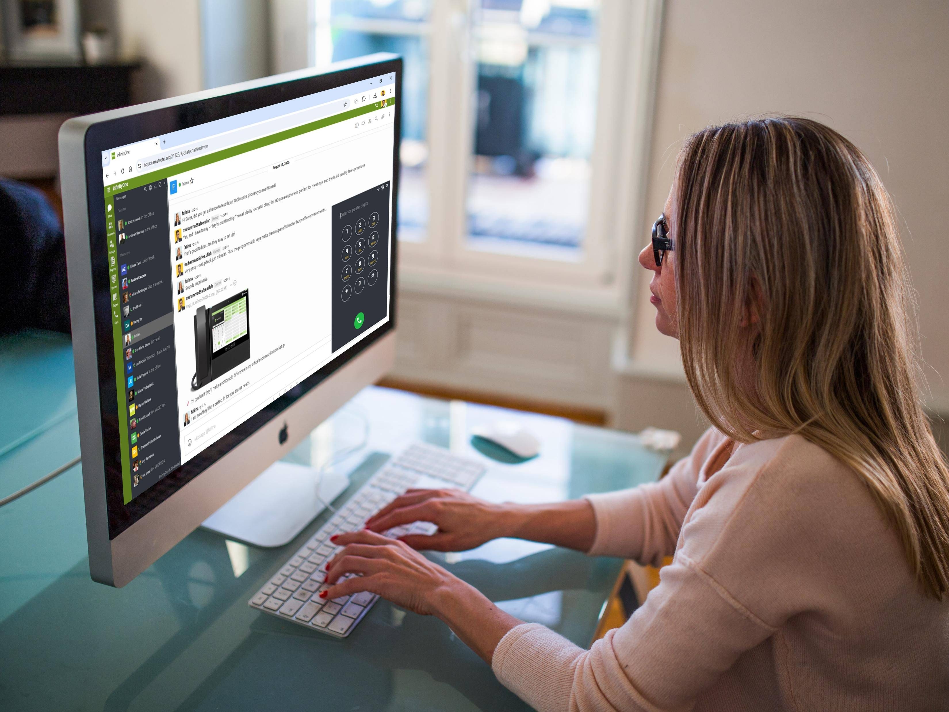 Woman working on a computer at home, focused on her project.