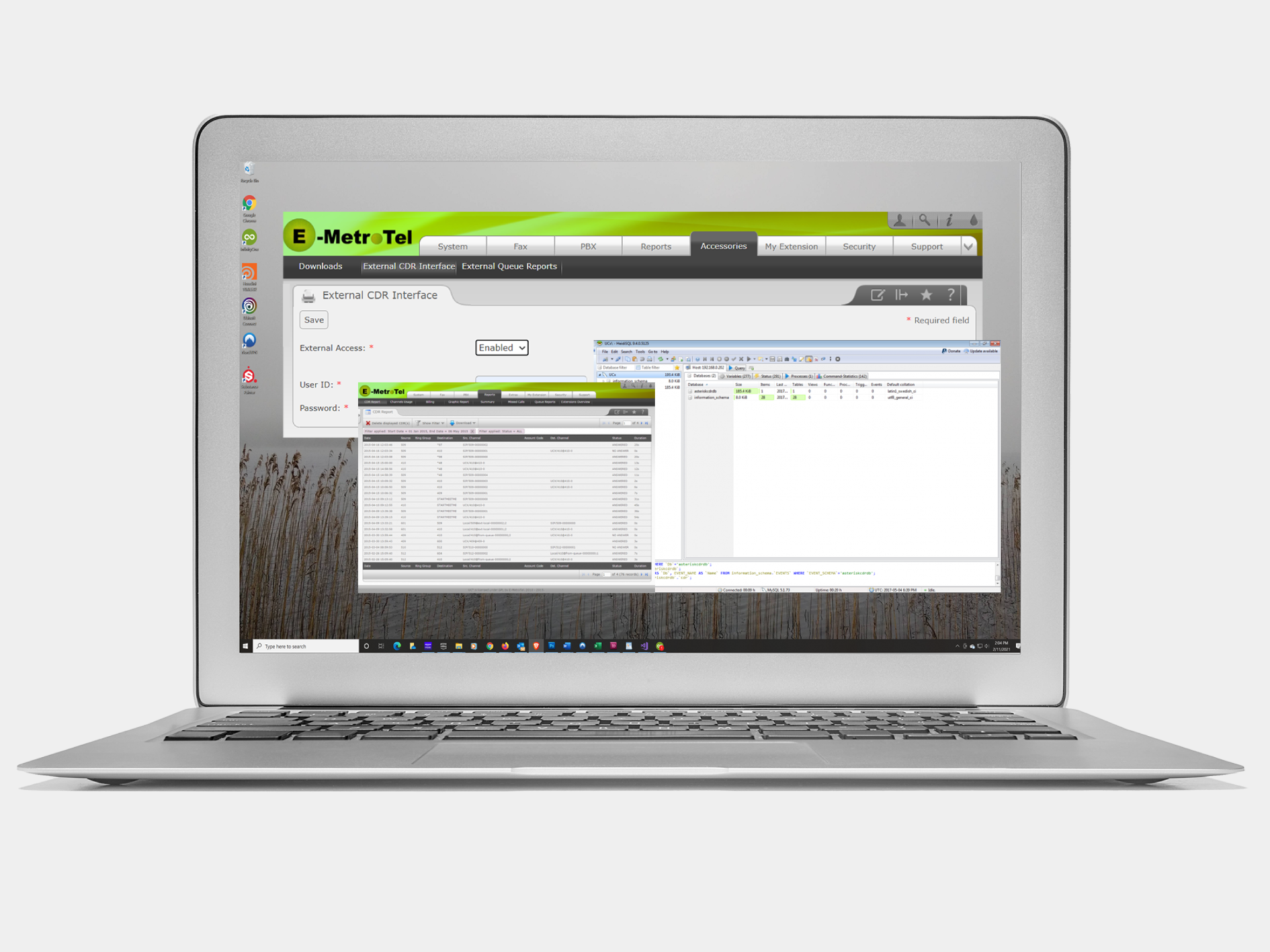 Laptop displaying a software interface with coding and data windows.
